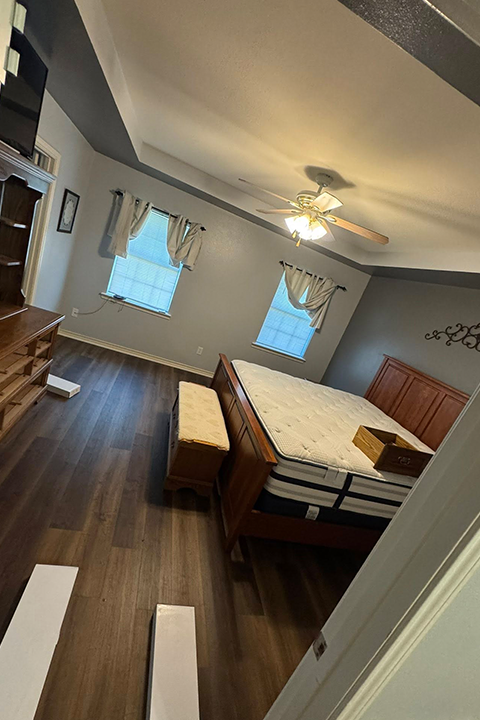 Cozy bedroom with wood flooring